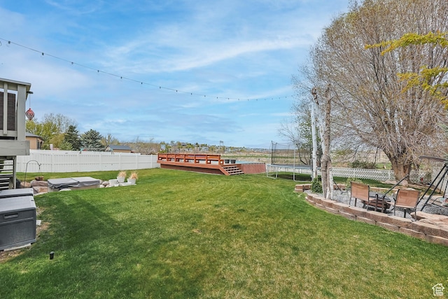 888 W Vahe St S, Draper, UT 84020 - view of yard featuring a patio, a fenced backyard, and a trampoline