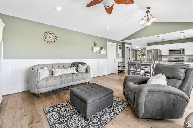 888 W Vahe St S, Draper, UT 84020 - living room with light wood-type flooring, vaulted ceiling, a wainscoted wall, and ceiling fan