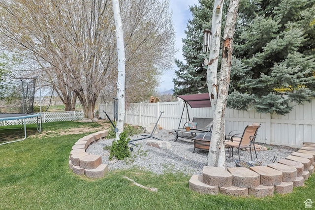 888 W Vahe St S, Draper, UT 84020 - view of yard featuring a trampoline, a patio, and a fenced backyard