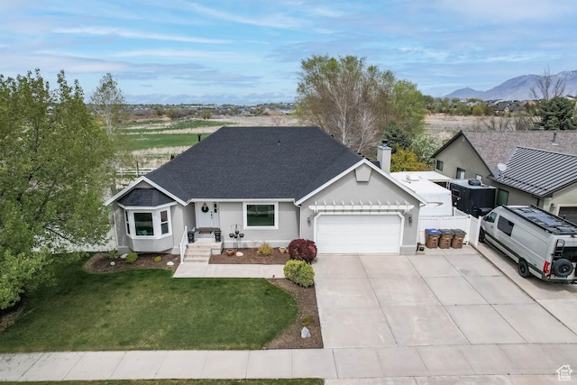 888 W Vahe St S, Draper, UT 84020 - single story home with a front lawn, an attached garage, driveway, roof with shingles, and a mountain view