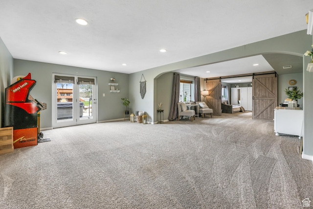 888 W Vahe St S, Draper, UT 84020 - living room with arched walkways, carpet floors, recessed lighting, and a barn door