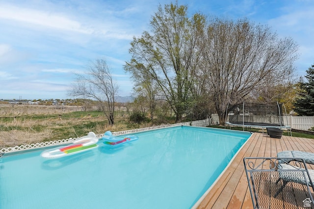 888 W Vahe St S, Draper, UT 84020 - view of pool featuring fence, a deck, and a trampoline