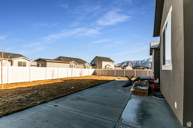 1038 W Regatta Ln, Stansbury Park, UT 84074 - view of patio with a mountain view
