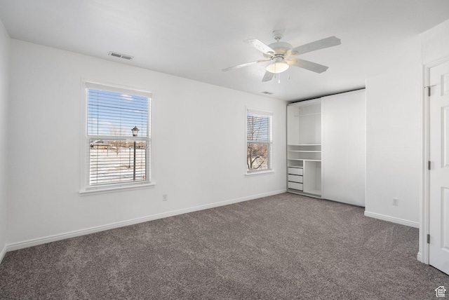 unfurnished bedroom featuring ceiling fan and carpet flooring
