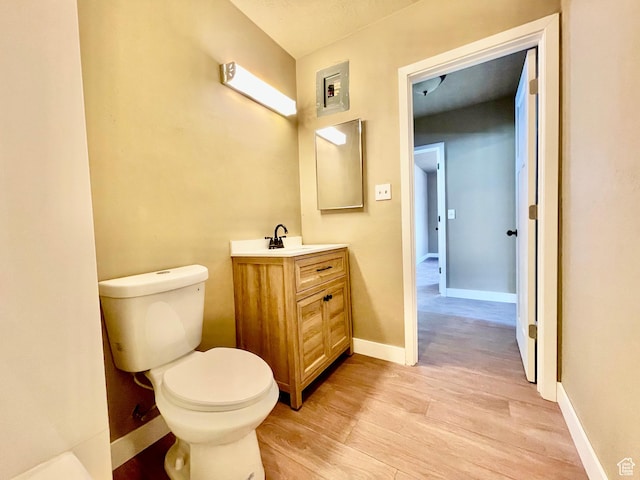 255 W Main St, Mount Pleasant, UT 84647 - half bathroom featuring vanity and wood finished floors