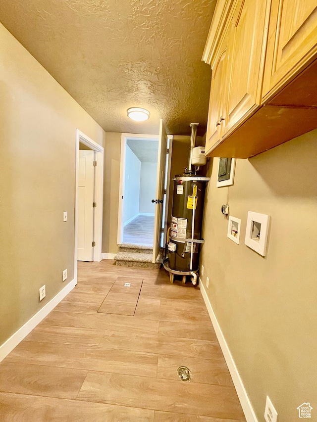 255 W Main St, Mount Pleasant, UT 84647 - hallway featuring gas water heater, a textured ceiling, and light wood finished floors