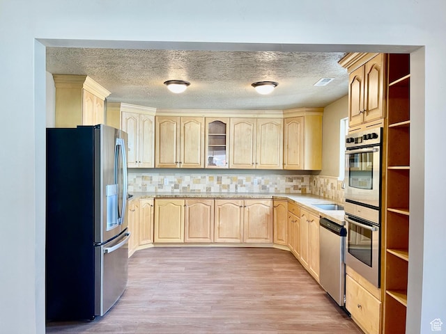 255 W Main St, Mount Pleasant, UT 84647 - kitchen featuring stainless steel appliances, light brown cabinetry, light wood-style floors, open shelves, and a textured ceiling