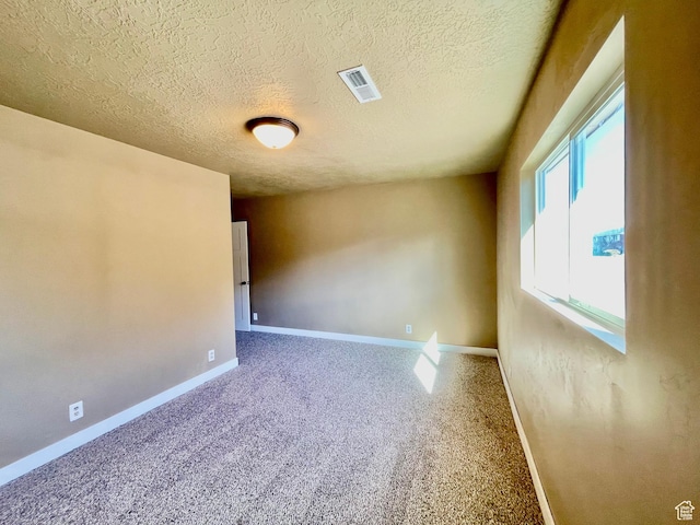 255 W Main St, Mount Pleasant, UT 84647 - carpeted empty room featuring a textured ceiling