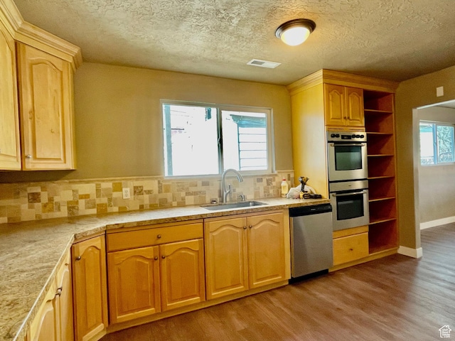 255 W Main St, Mount Pleasant, UT 84647 - kitchen with stainless steel appliances, light wood-type flooring, backsplash, open shelves, and a textured ceiling