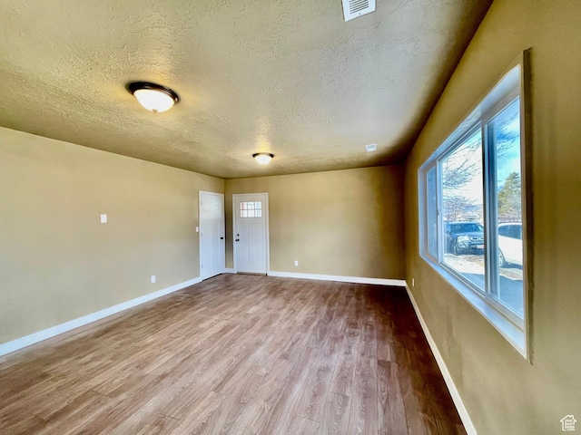 255 W Main St, Mount Pleasant, UT 84647 - unfurnished room with a textured ceiling and wood finished floors