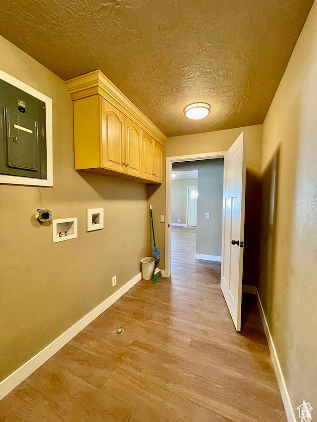 255 W Main St, Mount Pleasant, UT 84647 - laundry room with light wood finished floors, hookup for a washing machine, cabinet space, and a textured ceiling