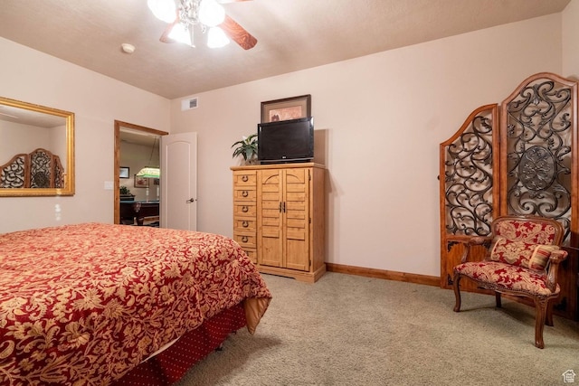 bedroom featuring light carpet and ceiling fan