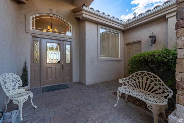 entrance to property featuring a patio area