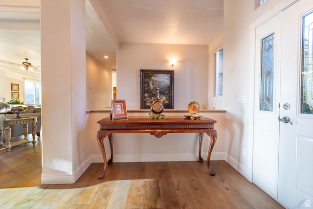 foyer featuring ceiling fan and light hardwood / wood-style flooring