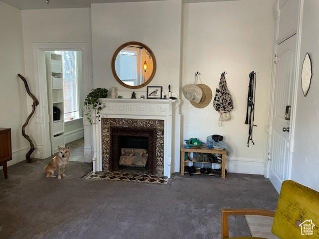 173 N K St E, Salt Lake City, UT 84103 - living room featuring dark carpet and a high end fireplace
