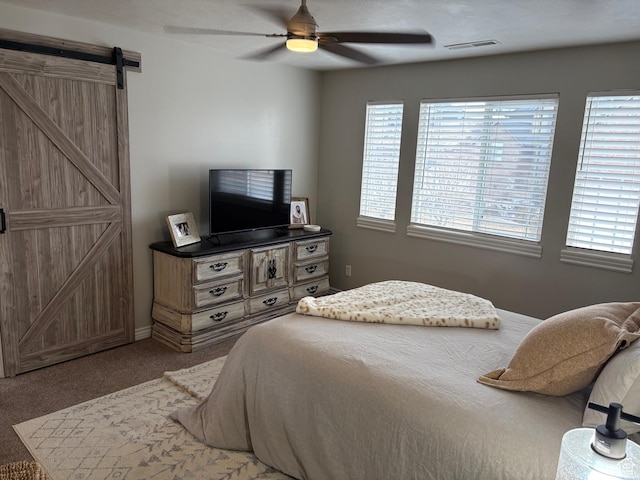 840 N Great View Dr E, Morgan, UT 84050 - carpeted bedroom with a barn door and a ceiling fan