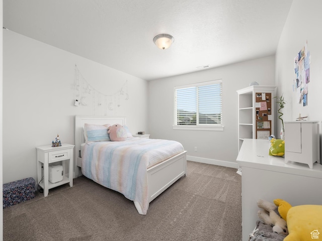 bedroom with light carpet, visible vents, and baseboards