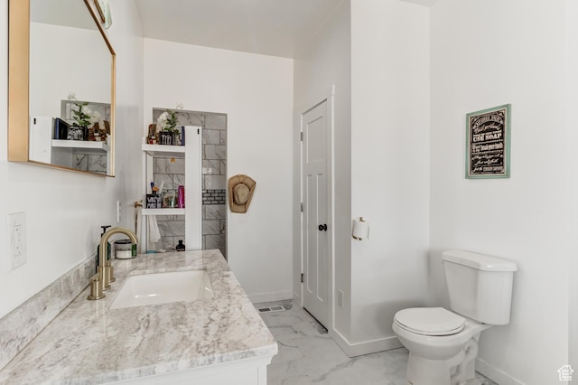 720 S 700 E, Mount Pleasant, UT 84647 - bathroom with toilet, baseboards, marble finish floor, and vanity