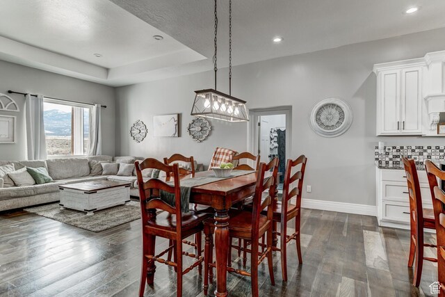 720 S 700 E, Mount Pleasant, UT 84647 - dining area featuring dark wood-type flooring, recessed lighting, baseboards, and a tray ceiling