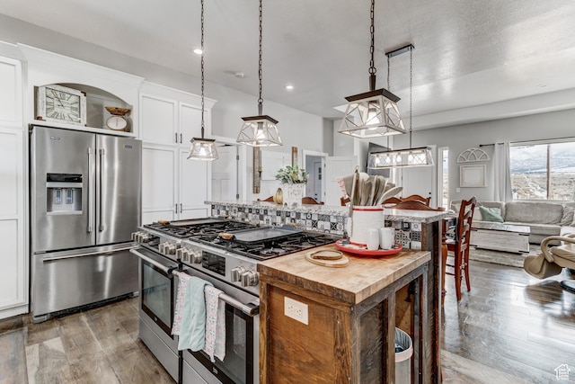 720 S 700 E, Mount Pleasant, UT 84647 - kitchen featuring butcher block countertops, a center island, white cabinetry, dark wood finished floors, and stainless steel appliances