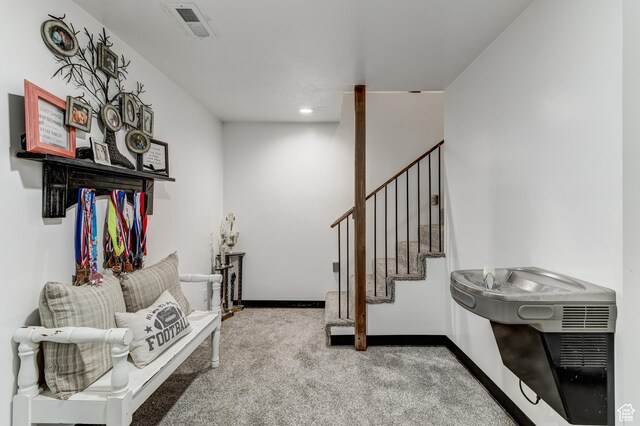720 S 700 E, Mount Pleasant, UT 84647 - living area featuring carpet flooring, baseboards, visible vents, and stairway