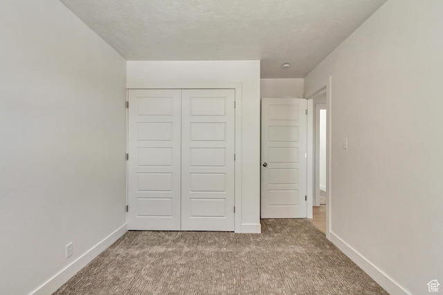 320 S 7 E, Tooele, UT 84074 - unfurnished bedroom with carpet floors, baseboards, and a closet