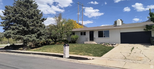 320 S 7 E, Tooele, UT 84074 - ranch-style house featuring a garage, a front lawn, driveway, and a chimney