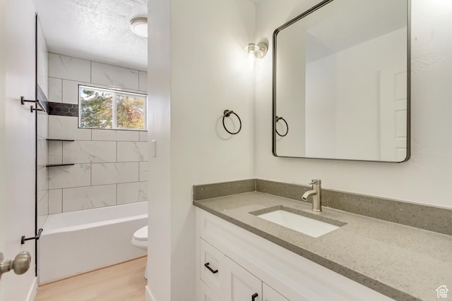 320 S 7 E, Tooele, UT 84074 - bathroom with vanity, wood finished floors, toilet, and bathtub / shower combination