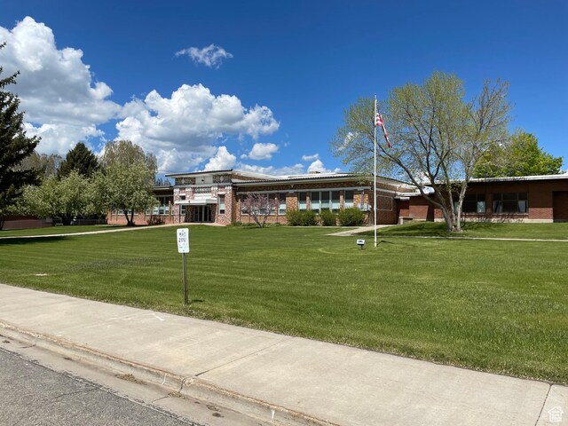 114 4th, Georgetown, ID 83239 - view of front of property featuring a front yard and brick siding