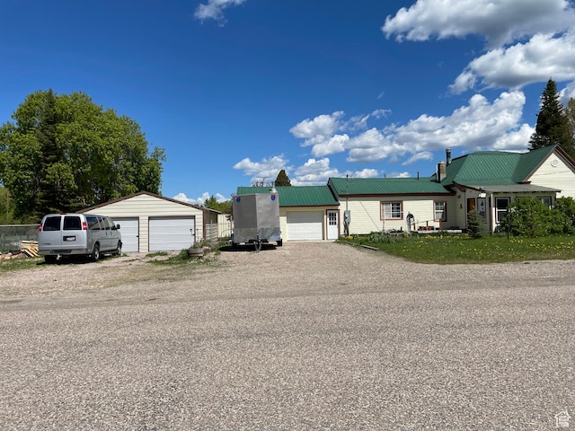 114 4th, Georgetown, ID 83239 - view of front facade with a garage and metal roof