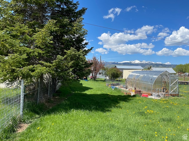 114 4th, Georgetown, ID 83239 - view of yard featuring a greenhouse and an outdoor structure