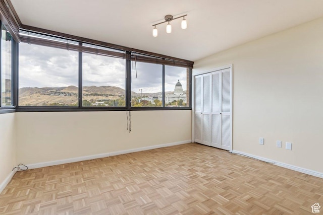 241 N Vine St Unit 1201E, Salt Lake City, UT 84103 - empty room with light parquet floors and a mountain view
