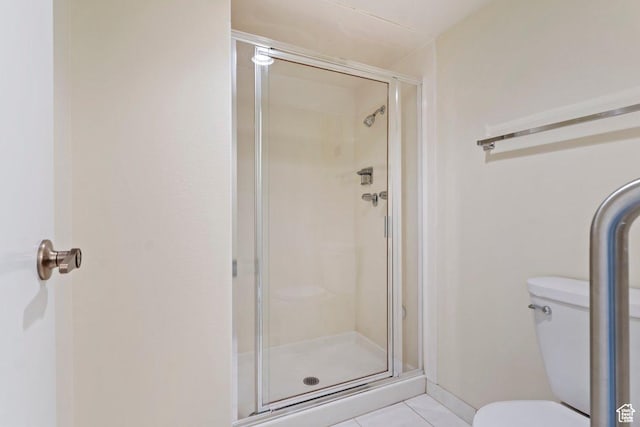 241 N Vine St Unit 1201E, Salt Lake City, UT 84103 - bathroom with walk in shower, tile patterned floors, and toilet