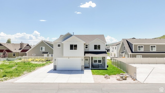 356 W Rendezvous Way, Garden City, UT 84028 - view of front of property featuring a garage, stone siding, driveway, and a residential view