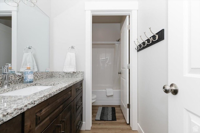 356 W Rendezvous Way, Garden City, UT 84028 - full bathroom featuring vanity, toilet, hardwood / wood-style floors, and shower / bath combo with shower curtain