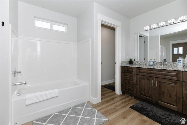 356 W Rendezvous Way, Garden City, UT 84028 - bathroom featuring vanity, hardwood / wood-style flooring, a tub, and toilet