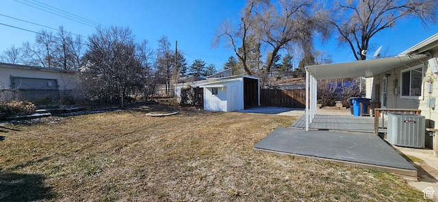 view of yard with cooling unit and a shed