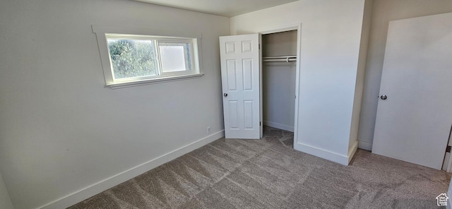 unfurnished bedroom with a closet and carpet