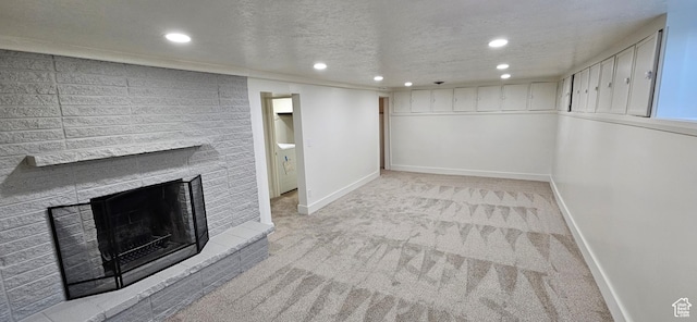 unfurnished living room with a brick fireplace, light colored carpet, and a textured ceiling