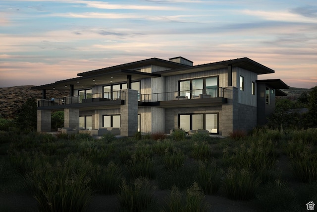 view of front of property with a balcony