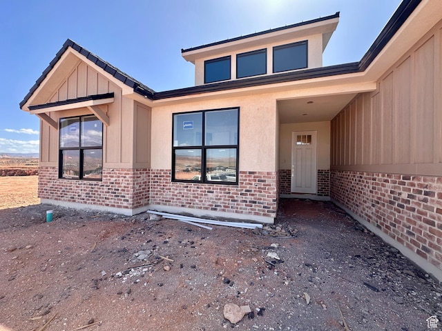 1589 S 4000 W Unit 12, Hurricane, UT 84737 - entrance to property featuring brick siding, board and batten siding, and stucco siding