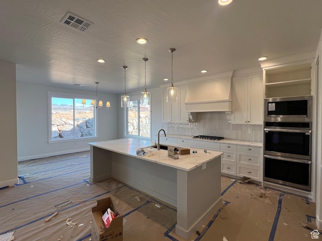 1589 S 4000 W Unit 12, Hurricane, UT 84737 - kitchen with premium range hood, stainless steel appliances, decorative backsplash, white cabinets, and recessed lighting