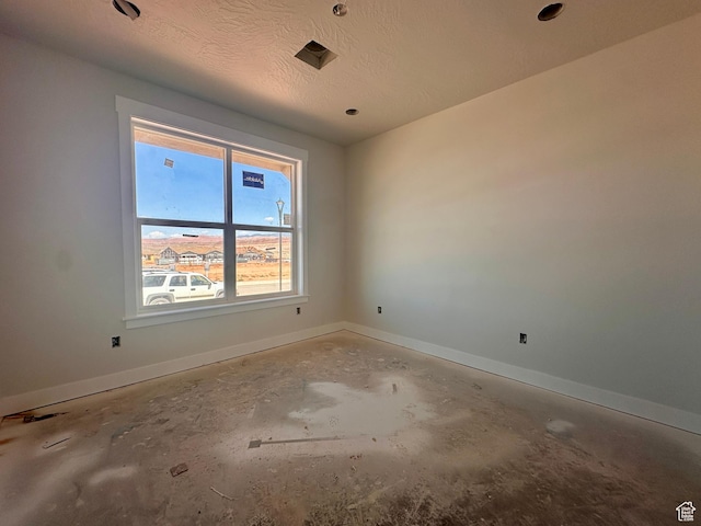 1589 S 4000 W Unit 12, Hurricane, UT 84737 - unfurnished room featuring baseboards, unfinished concrete floors, and a textured ceiling