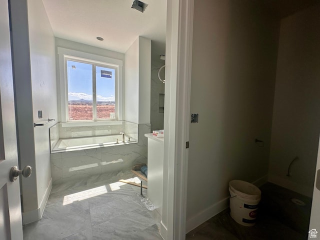 1589 S 4000 W Unit 12, Hurricane, UT 84737 - bathroom with marble finish flooring, a garden tub, and baseboards