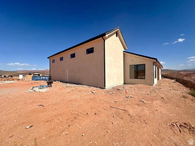 1589 S 4000 W Unit 12, Hurricane, UT 84737 - view of side of property featuring stucco siding