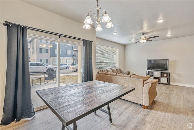 1079 W 420 S Unit 102, American Fork, UT 84003 - dining space with ceiling fan with notable chandelier and light hardwood / wood-style flooring