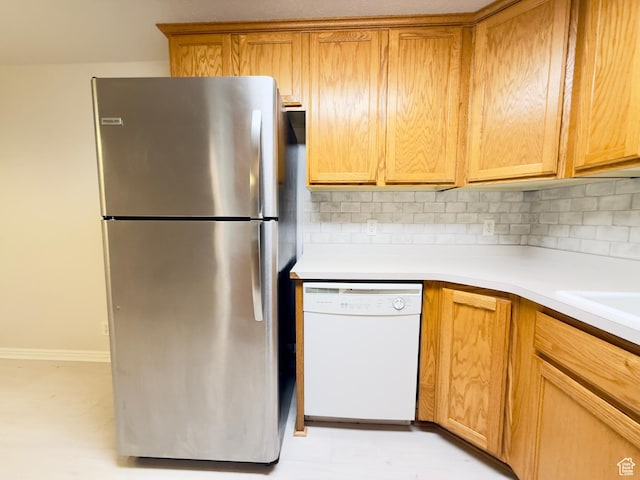 1444 S 430 W Unit 7, Orem, UT 84058 - kitchen with freestanding refrigerator, white dishwasher, decorative backsplash, and light countertops