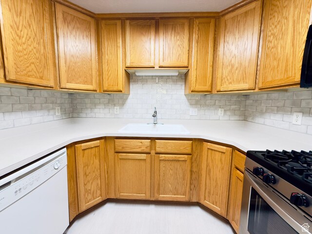 1444 S 430 W Unit 7, Orem, UT 84058 - kitchen featuring dishwasher, stainless steel gas stove, backsplash, and light countertops