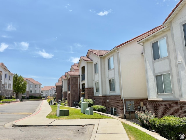 1444 S 430 W Unit 7, Orem, UT 84058 - view of asphalt street featuring a residential view, sidewalks, and curbs