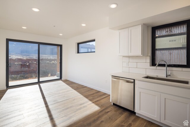 1185 S Murphy Ln Unit 201A, Moab, UT 84532 - kitchen featuring dishwasher, a sink, dark wood finished floors, baseboards, and recessed lighting